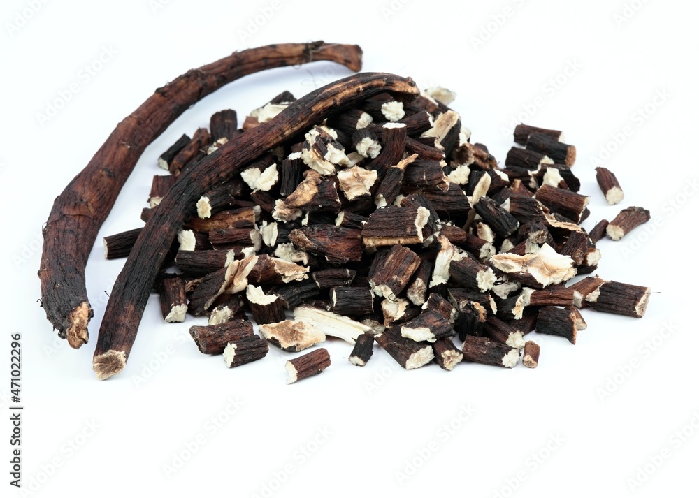 Roots of chinese dong quai, Angelica sinensis, traditional herbal medicine. Roots prepared for making tinctures and medicine on the white background. Roots of chinese dong quai, Angelica sinensis, traditional herbal medicine. Roots prepared for making tinctures and medicine on the white background.