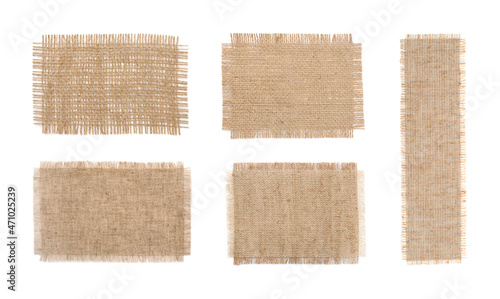 Set with pieces of natural burlap fabric on white background, top view