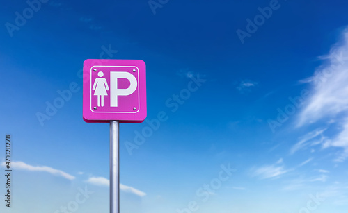 Lady parking sign on metal pole with cloudy and blueskybackground. photo