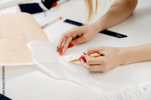 Small business home concept. Woman seamstress tailor prepares materials for sewing modern lingerie