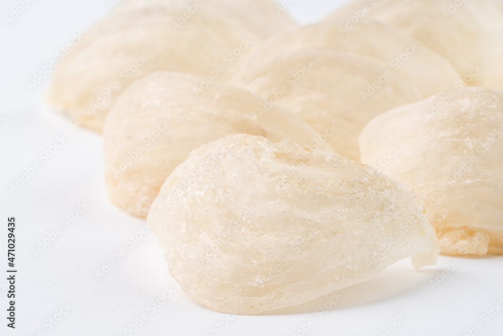 Top Grade edible bird nest shoot on white background with negative space. Raw edible bird's nest materials for tradition chinese medicine. Swallow nest the traditional chinese delicacy. Top Grade edible bird nest shoot on white background with negative space. Raw edible bird's nest materials for tradition chinese medicine. Swallow nest the traditional chinese delicacy.