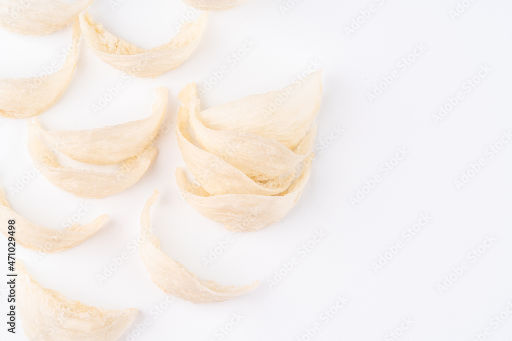 Top Grade edible bird nest shoot on white background with negative space. Raw edible bird's nest materials for tradition chinese medicine. Swallow nest the traditional chinese delicacy. Top Grade edible bird nest shoot on white background with negative space. Raw edible bird's nest materials for tradition chinese medicine. Swallow nest the traditional chinese delicacy.