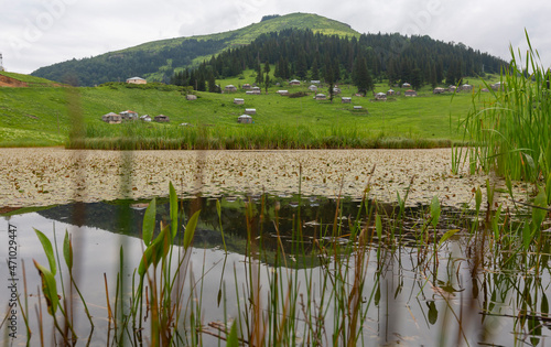 Located in the province of Giresun, Gölyanı Plateau has a lake offering an authentic view with its wooden houses. photo