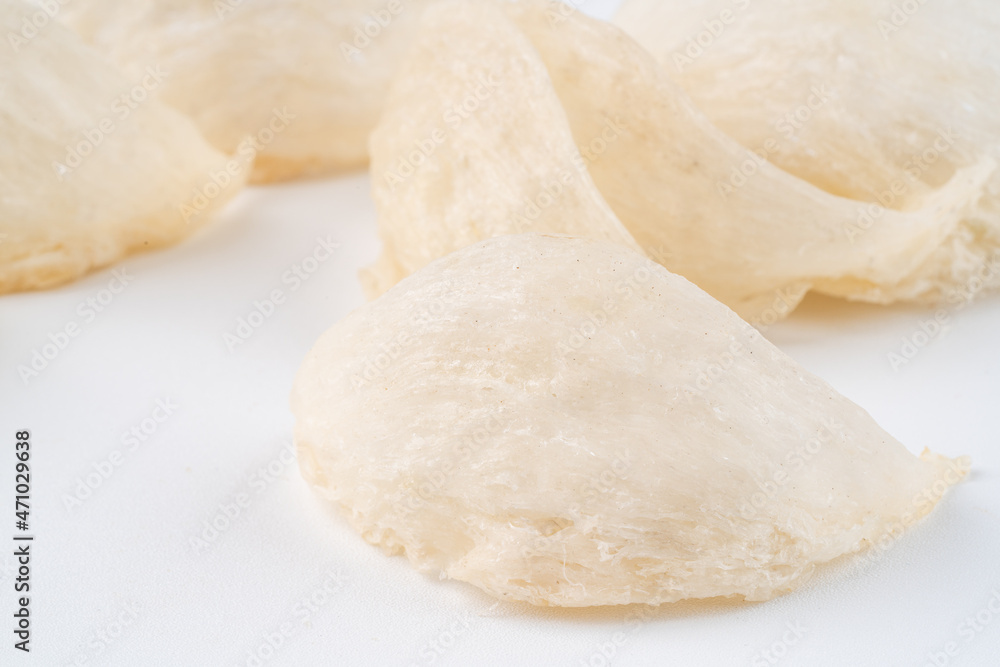 Top Grade edible bird nest shoot on white background with negative space. Raw edible bird's nest materials for tradition chinese medicine. Swallow nest the traditional chinese delicacy.