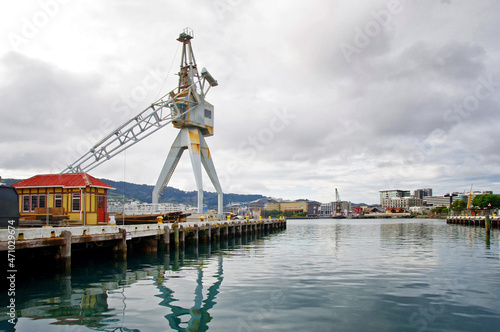 Logistics concept. Shipping. Crane in the port and cloudy sky in the background.