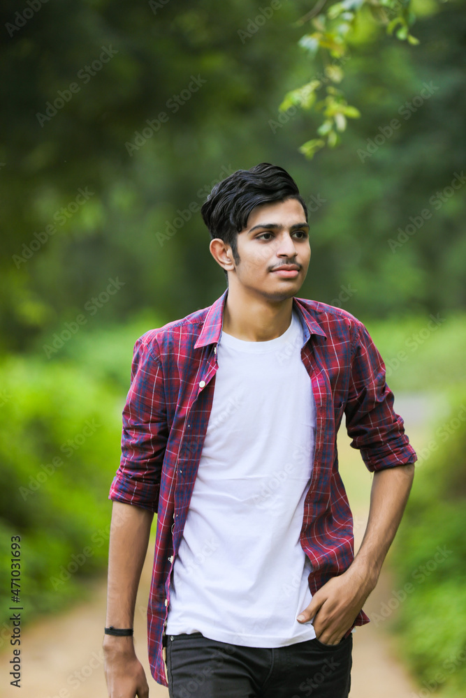Young indian college student showing expression.