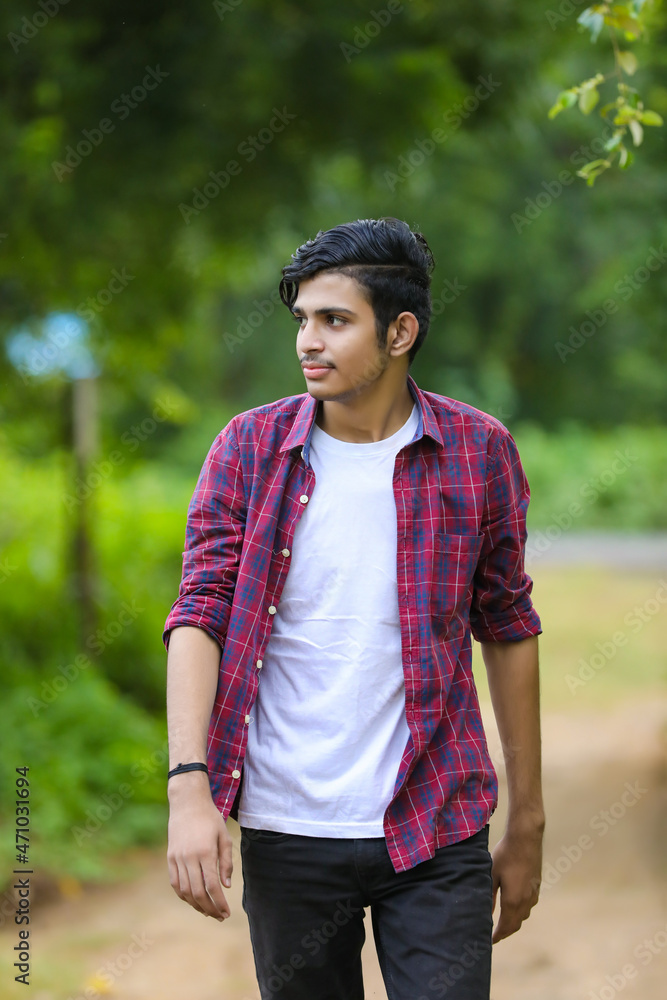 Fototapeta premium Young indian college student showing expression.