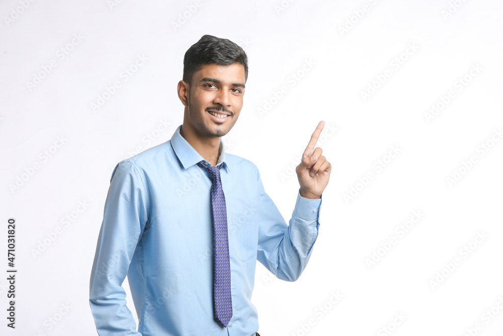 Successful Young indian business man posing over white background Successful Young indian business man posing over white background
