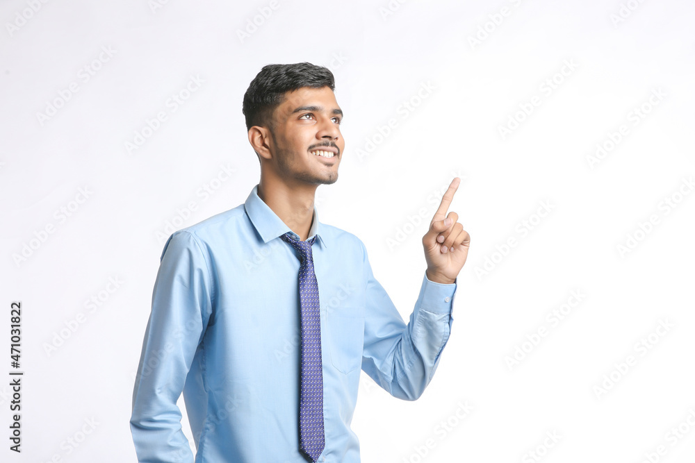 Successful Young indian business man posing over white background Successful Young indian business man posing over white background