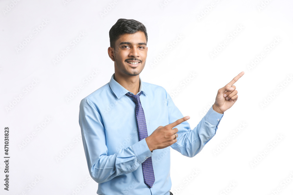 Successful Young indian business man posing over white background Successful Young indian business man posing over white background