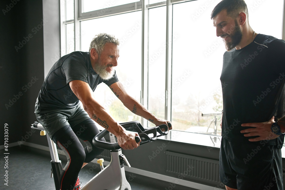 Mature man cycling on the top of physical abilities Mature man cycling on the top of physical abilities