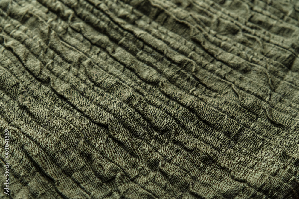 abstract background of an old green cotton voluminous knit fabric abstract background of an old green cotton voluminous knit fabric