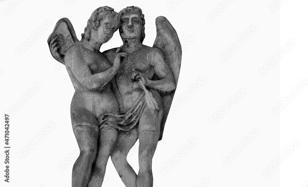 Cupid and Psyche. An ancient stone statue against white background.