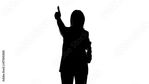 Photo of woman's silhouette in suit jacket with thumb gesture