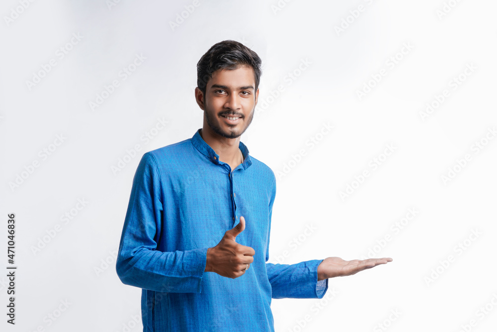 Indian man in tradition wear and giving expression on white background. Indian man in tradition wear and giving expression on white background.