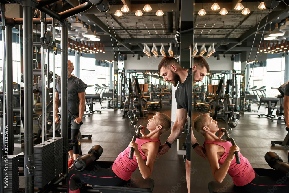 Fényképezés Attractive middle aged woman working out in gym