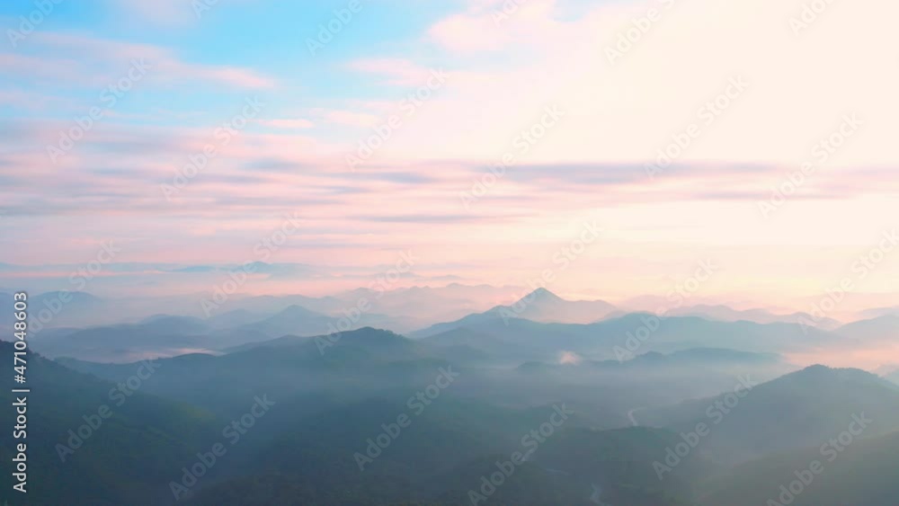 4K Flying through the clouds above mountain tops. Tropical forest with smoke and fog.
4K Flying through the clouds above mountain tops. Tropical forest with smoke and fog.
