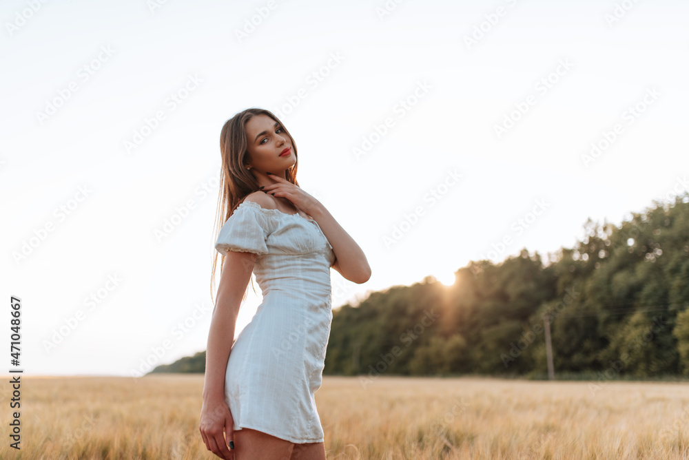 brunette in white in a wheat field brunette in white in a wheat field
