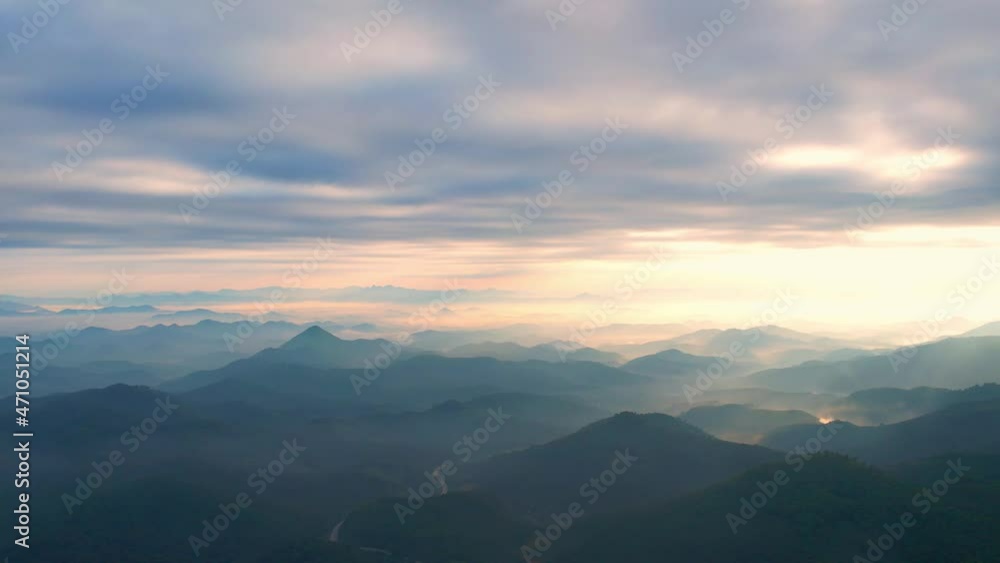 4K Flying through the clouds above mountain tops. Tropical forest with smoke and fog.
4K Flying through the clouds above mountain tops. Tropical forest with smoke and fog.