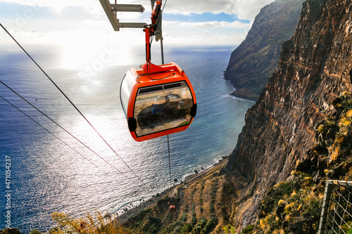 Road from the sky to the beach - mountain cable car Cabo Girao, popular tourist attraction and beautiful scenery in Madeira island photo