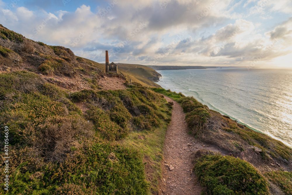 View of Wheal Coates, a disused mine factory along the coast facing the ocean, St Agnes, Cornwall, United Kingdom. View of Wheal Coates, a disused mine factory along the coast facing the ocean, St Agnes, Cornwall, United Kingdom.