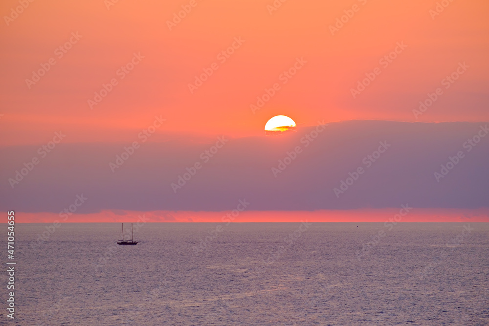 View on a beautiful sunset on the sea and a boat, Fuerteventura. View on a beautiful sunset on the sea and a boat, Fuerteventura.