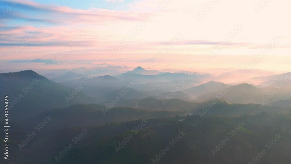 4K aerial view from a drone flying over the valley, fog in the morning.
4K aerial view from a drone flying over the valley, fog in the morning.