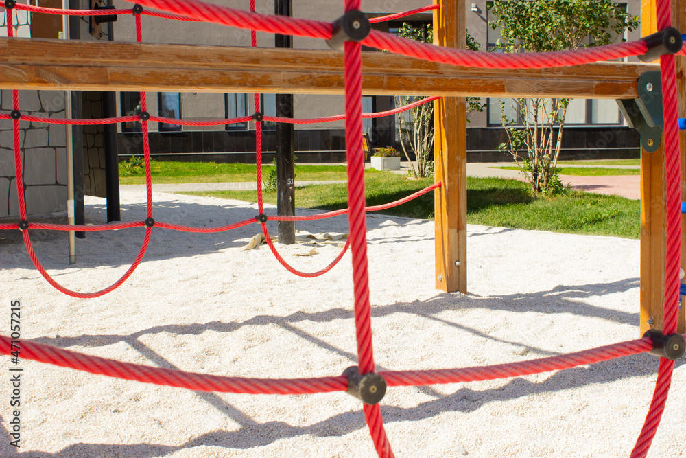 rope jungle for kids. Detail of cross red ropes in safety climbing outdoor equipment. rope jungle for kids. Detail of cross red ropes in safety climbing outdoor equipment.