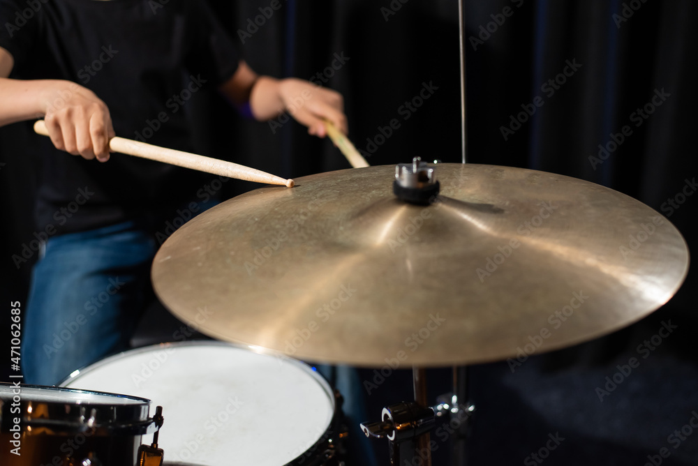 Close-up of drumsticks on a cymbal drum Close-up of drumsticks on a cymbal drum