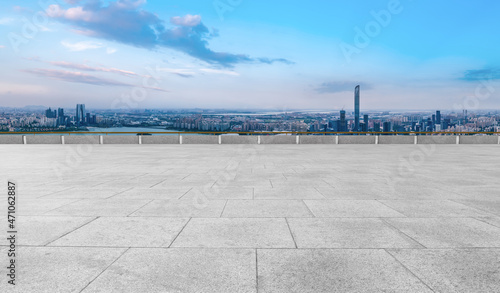 Empty brick floor with city skyline background © 昊 周