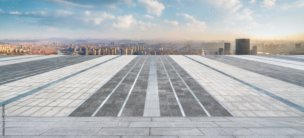 Empty brick floor with city skyline background Empty brick floor with city skyline background