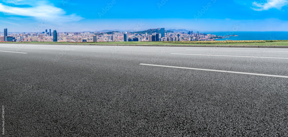 Fototapeta premium Empty asphalt road and city skyline and building landscape, China.