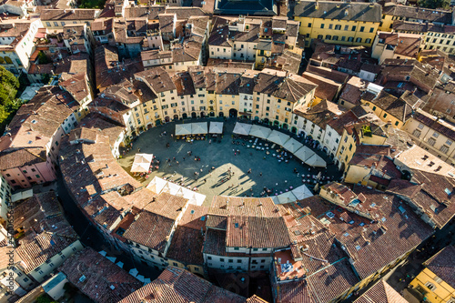 Aerial view of Piazza dell'Anfiteatro, a medieval square with cafè and market in Lucca old town, Tuscany, Italy. photo