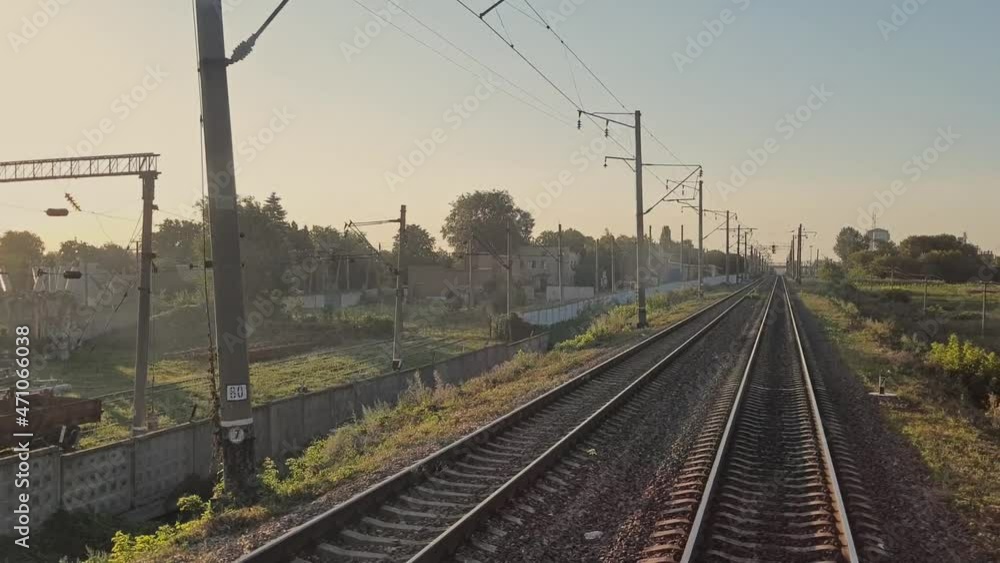 Train in motion. Railway. The train passes by the industrial area. View of the rails. Departure from the station. Trips. Tourism. Train in motion. Railway. The train passes by the industrial area. View of the rails. Departure from the station. Trips. Tourism.