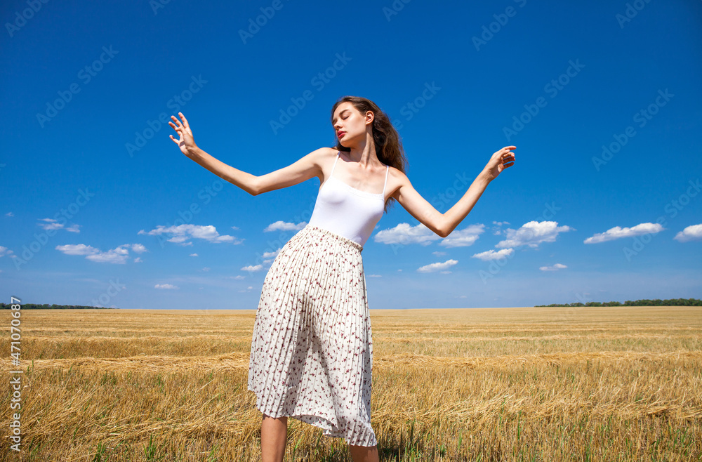 young beautiful blonde girl posing in a wheat field young beautiful blonde girl posing in a wheat field