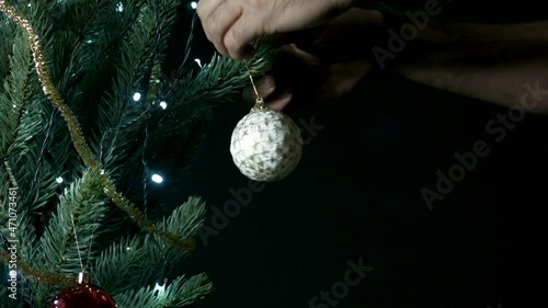 preparation of Christmas tree with its ornaments, colored balls, lights and gifts