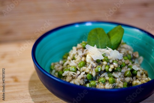 Italian rice risotto with fish and peas