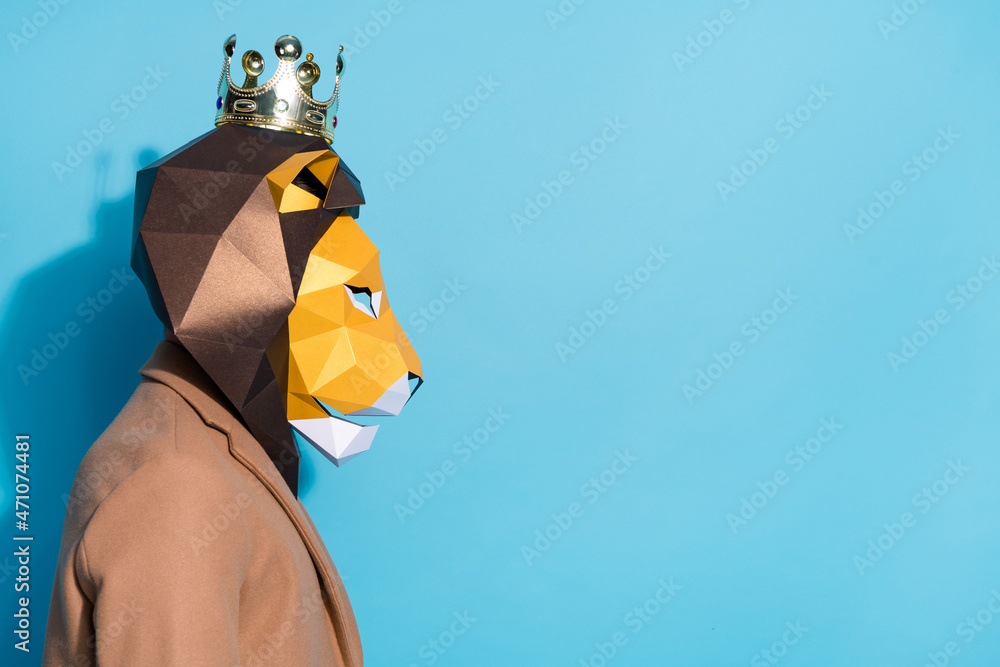 Profile side photo of authentic bizarre guy in lion mask look empty space offer theme party isolated over blue color background - obrazy, fototapety, plakaty 
