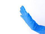 A hand with blue latex glove, refuse sign. Isolated on white background. Side view