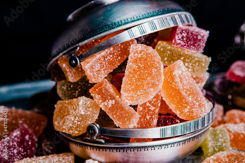 Dessert marmalade in the form of lemon and orange slices. The sweetness of jelly candy. photo