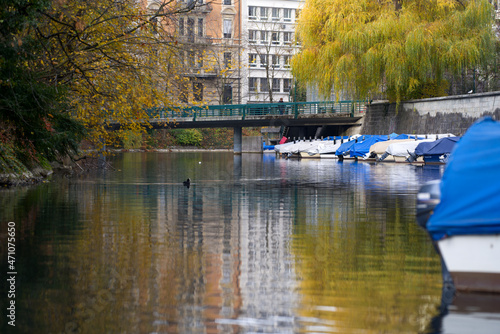 Canal named Schanzengraben with moored boats and beautiful reflections in water on a autumn day. Photo taken November 18th, 2021, Zurich, Switzerland.