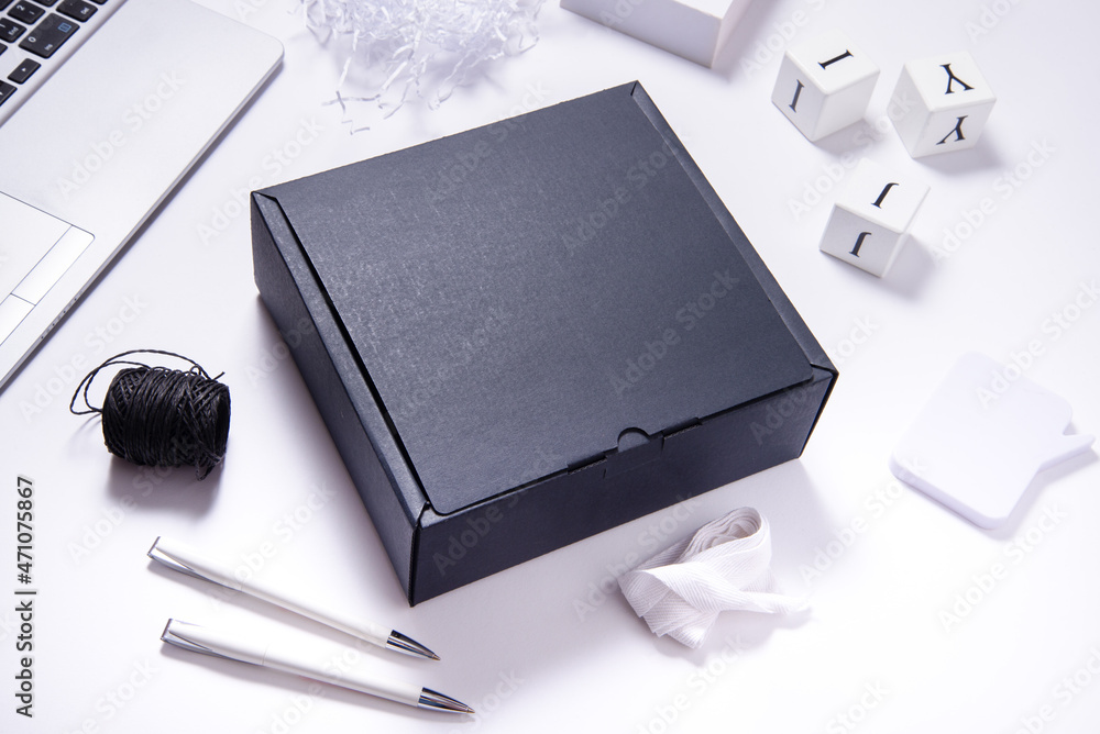 Black carton cardboard box top view, on office desk Stock Photo | Adobe  Stock