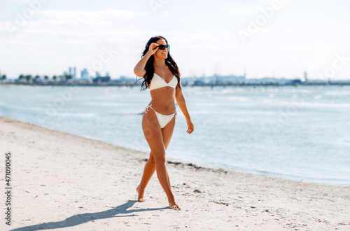 Canvas Print people, summer and swimwear concept - happy smiling young woman in bikini swimsu