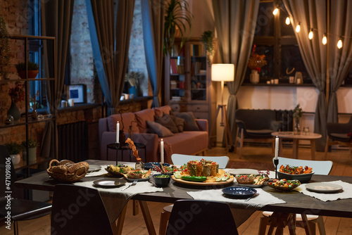 Image of dining table with food and appetizer preparing for dinner party in the living room