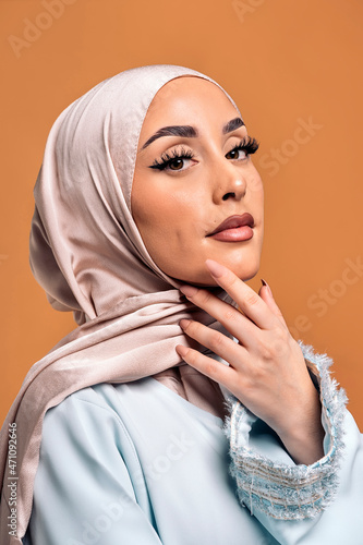 Young muslim woman looking at camera.