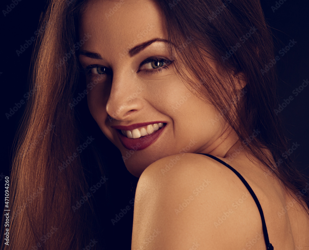 Beautiful makeup woman with long hair looking happy on black background. Closeup portrait Beautiful makeup woman with long hair looking happy on black background. Closeup portrait