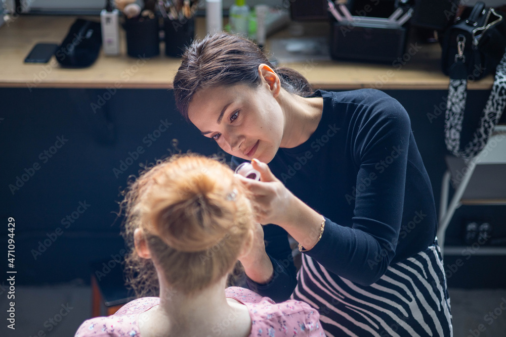 Woman visagist applying makeup cosmetic to pregnant woman getting ready. Make up artist working Woman visagist applying makeup cosmetic to pregnant woman getting ready. Make up artist working