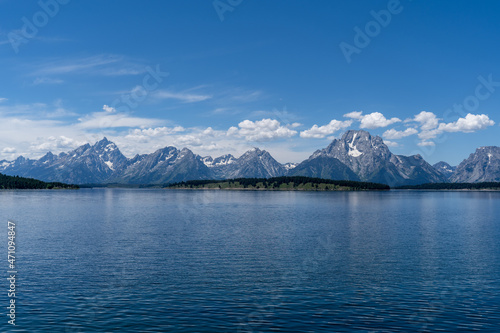 The blue waters of Jackson Lake on a sunny summer day in Grand Teton National Park near Jackson Hole, Wyoming