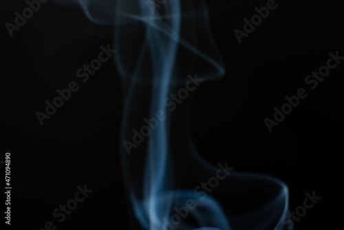 Fototapeta Naklejka Na Ścianę i Meble -  Abstract trickle of smoke on a black background.