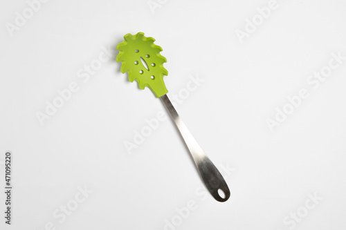 Metallic spoon for draining of spaghetti isolated on white background.High-resolution photo.Mockup